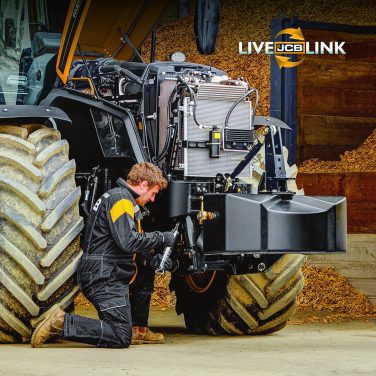 JCB mechanic working on a tractor