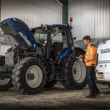 Valtra mechanic conducting fluid analysis on a tractor